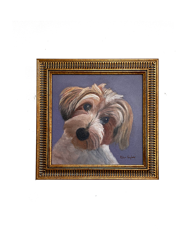 Framed painting of a dog's face on a white background