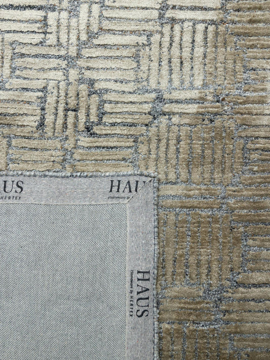 Textured fabric swatch with geometric pattern and 'HAUS' branding.