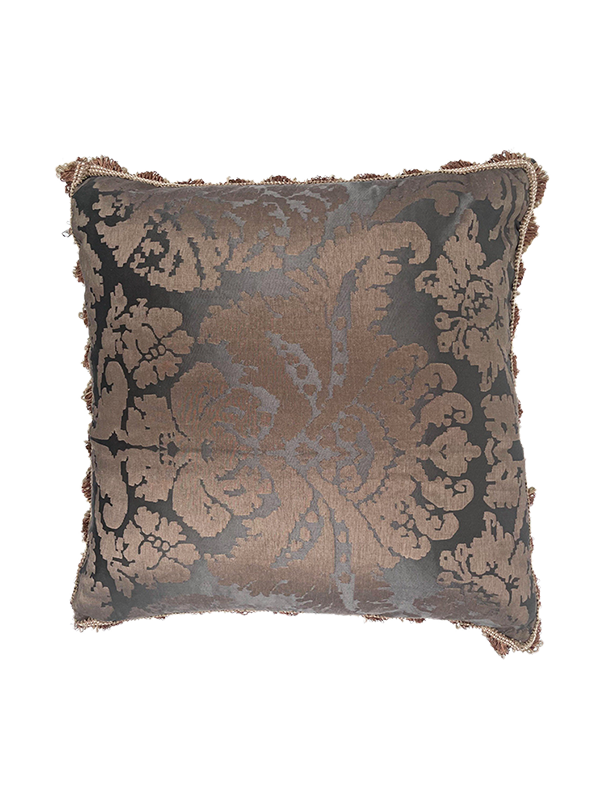 Decorative pillow with intricate pattern on a white background