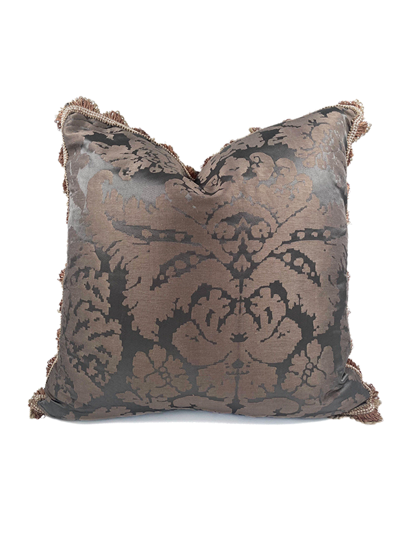 Decorative scatter cushion with intricate brown pattern on a white background