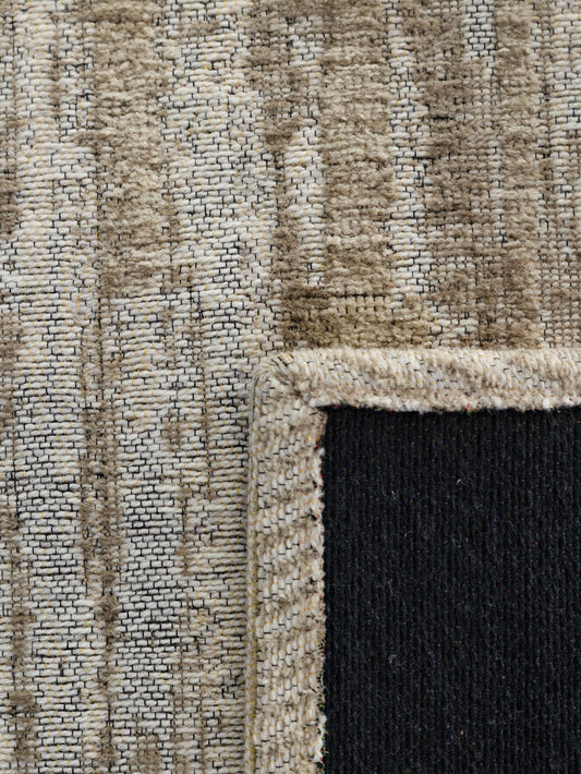 Close-up of a textured rug with a border
