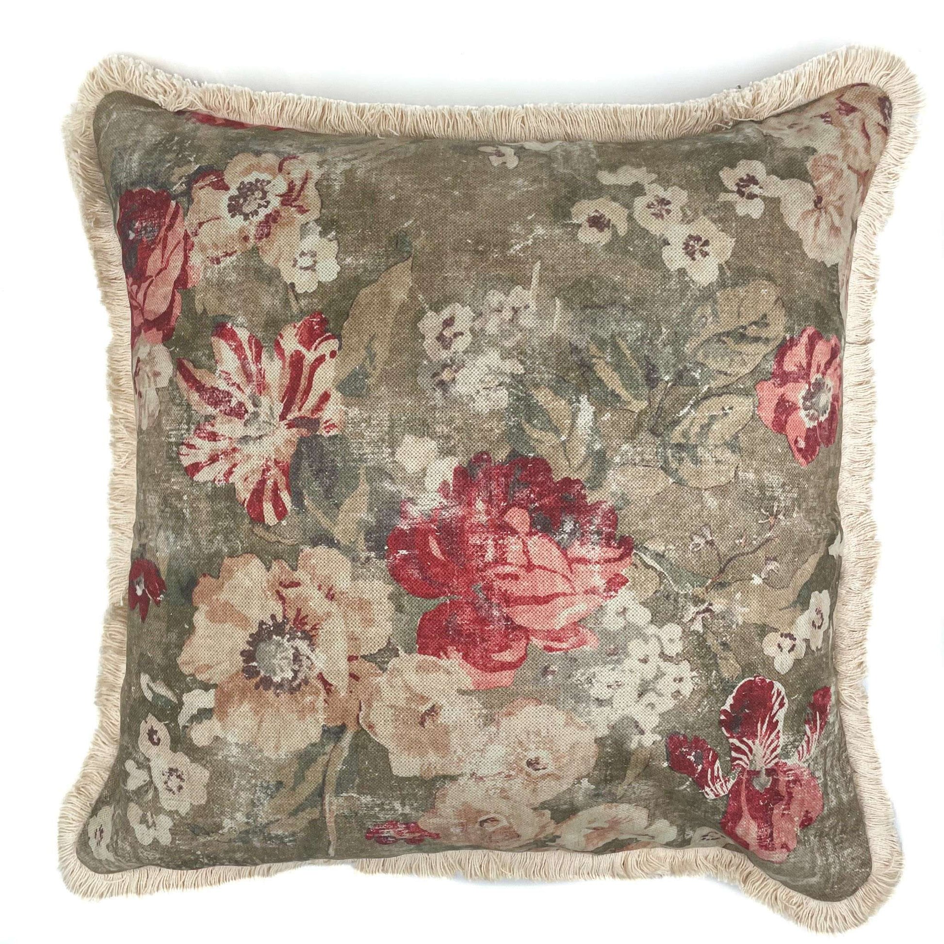 Floral patterned pillow with red and pink flowers on a beige background