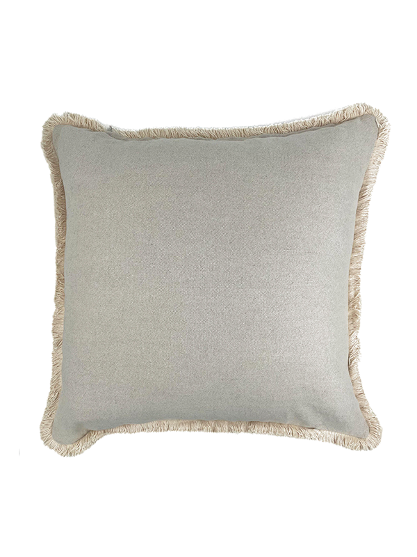 Beige linen scatter cushion with fringed edges on a white background