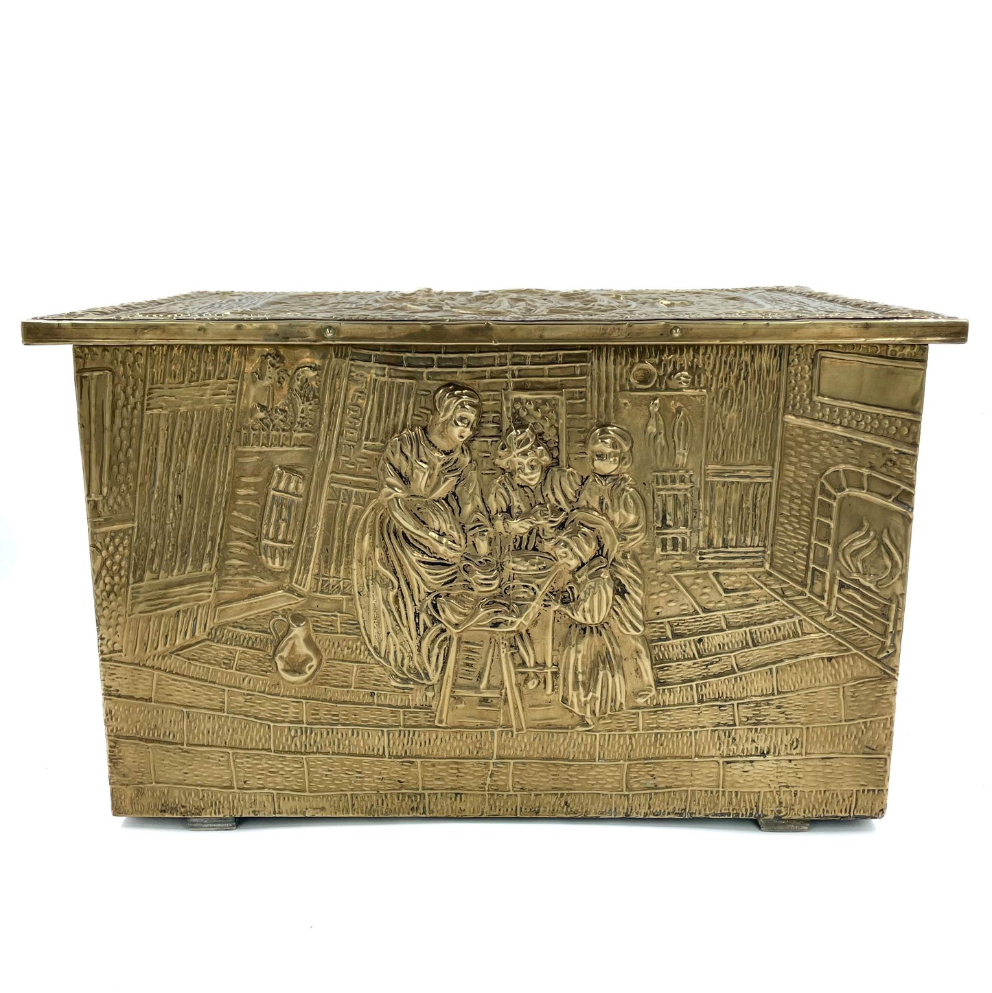An embossed brass box from the late 19th century, crafted using repoussé techniques, depict a scenes of historical domestic life evoking a sense of nostalgia and tradition. 