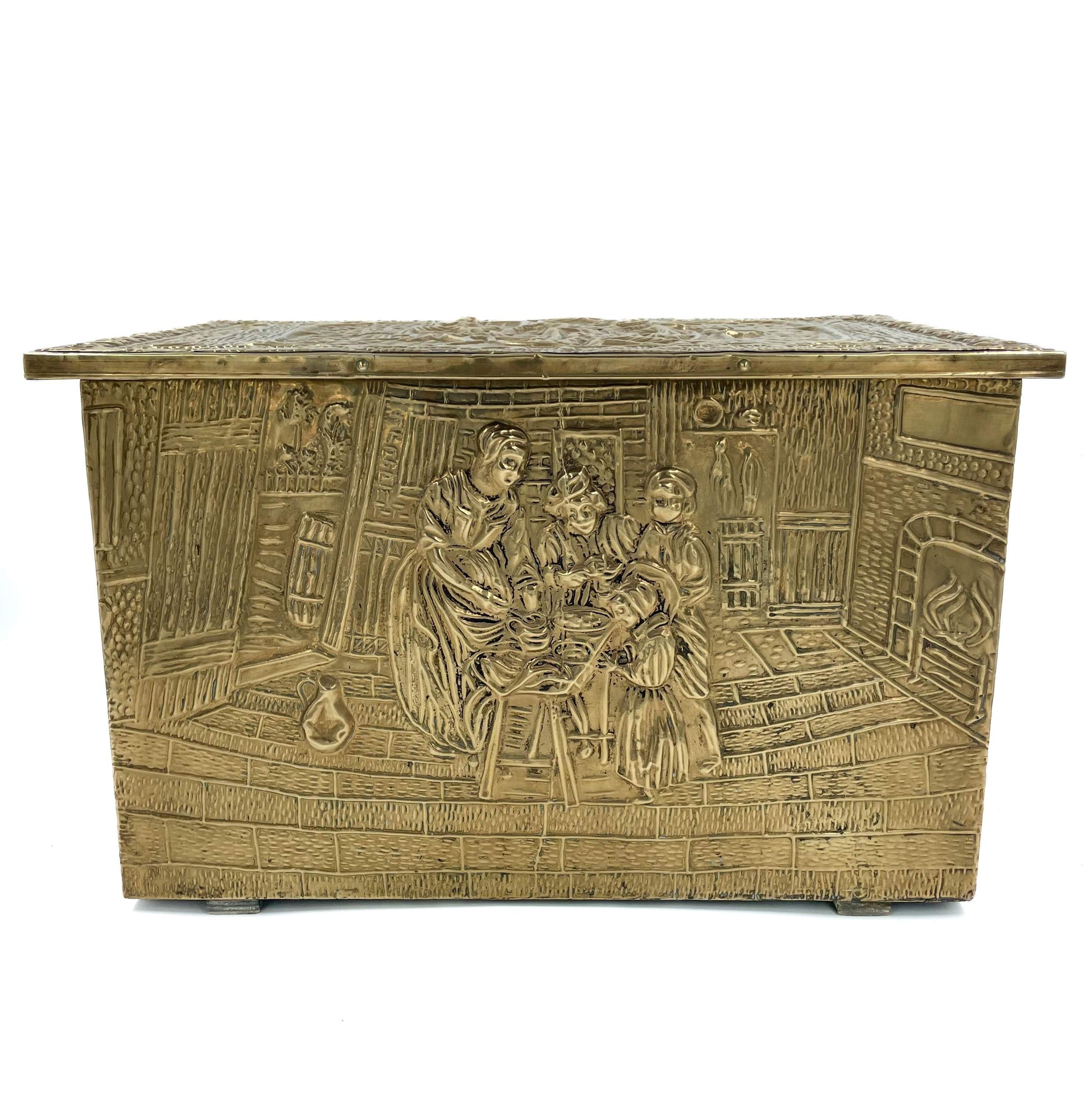 An embossed brass box from the late 19th century, crafted using repoussé techniques, depict a scenes of historical domestic life evoking a sense of nostalgia and tradition. 