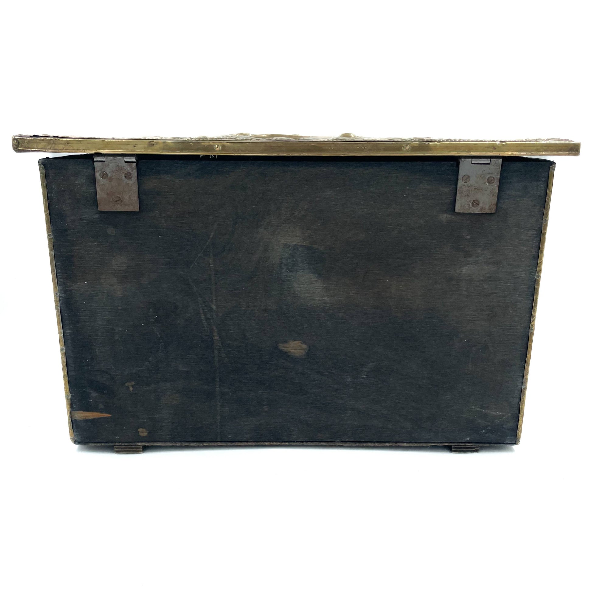 Back view of an embossed brass box from the late 19th century, crafted using repoussé techniques, depict a scenes of historical domestic life.