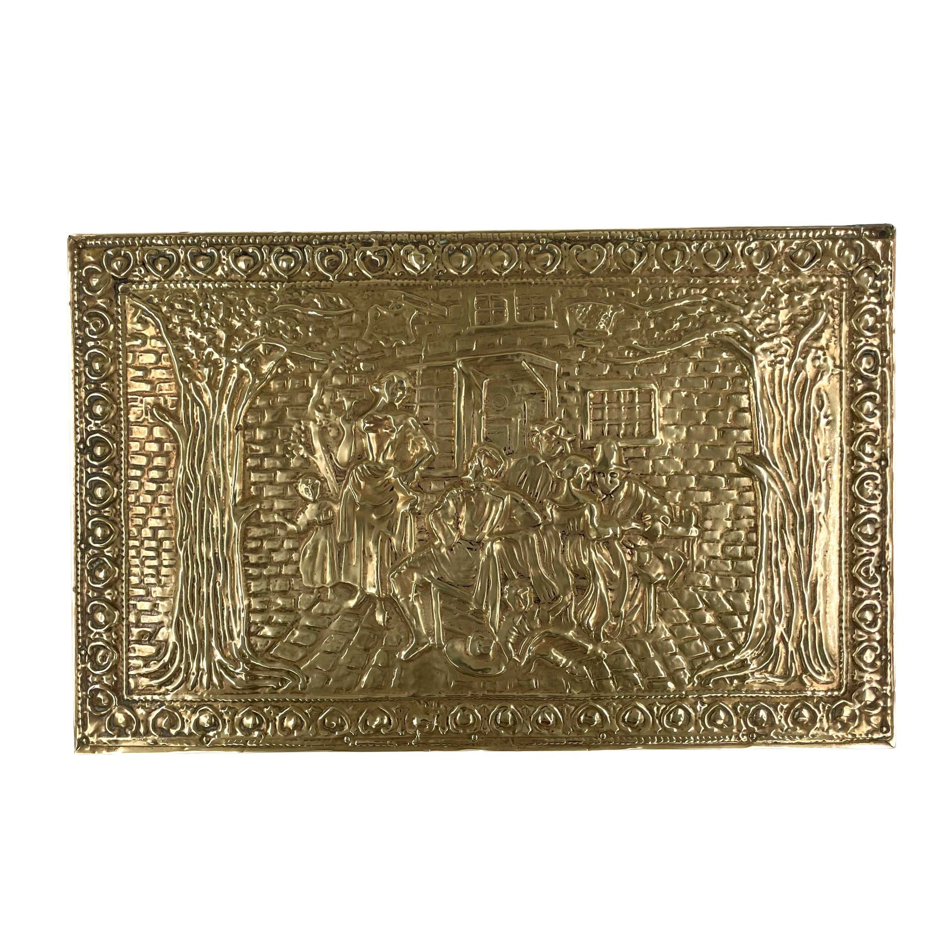 Top view of an embossed brass box from the late 19th century, crafted using repoussé techniques, depict a scenes of historical domestic life.