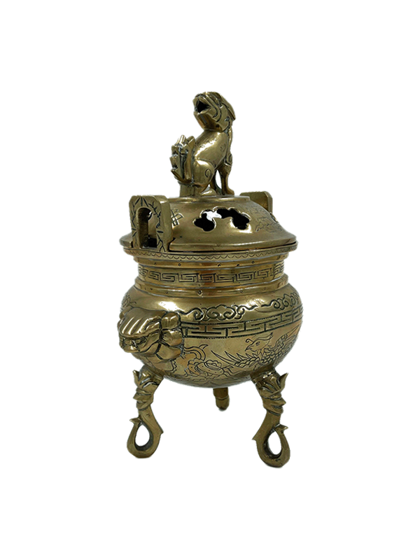 Vintage brass foo dog incense burner on a white background