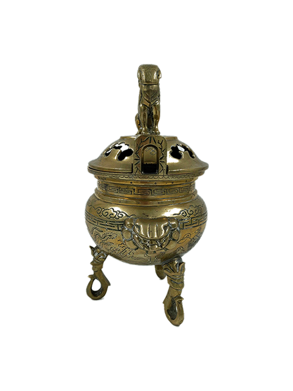 Vintage brass foo dog incense burner with decorative elements on a white background