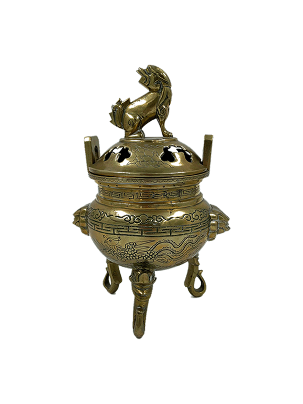 Vintage brass foo dog incense burner on a white background