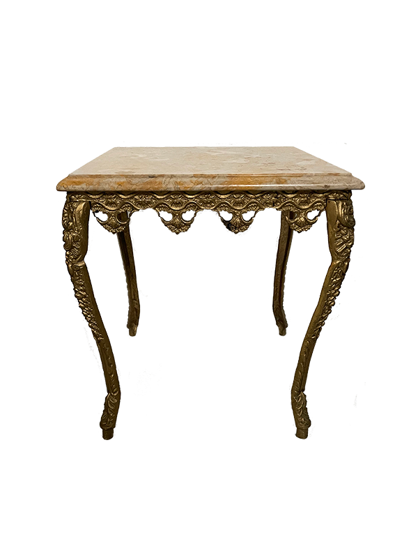 Decorative table with ornate gold legs and marble top on a white background