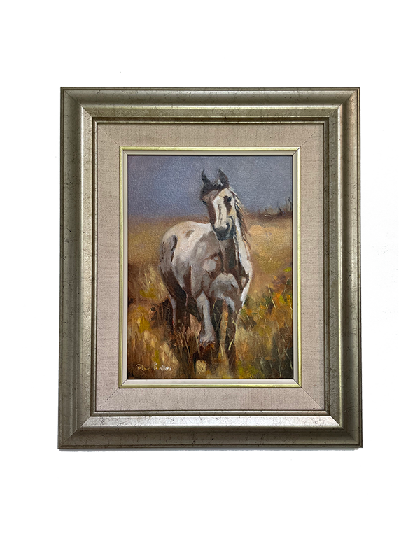 Framed oil painting of a white horse in a field